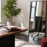 Modern office space with a wooden desk and an open laptop